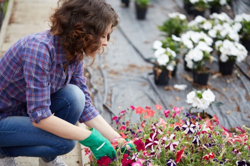 Front view of a gardener reviewing a complaint form in a garden